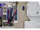 Functional laundry area featuring a stackable washer and dryer, next to a closet at 359 Heather Bluffs Dr, Garner, NC 27529