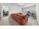 Comfortable living room featuring a large, cushioned sofa and a well-lit workspace, offering a versatile area at 359 Heather Bluffs Dr, Garner, NC 27529