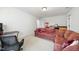 A rec room features a large, cushioned sofa with home theater accoutrements, perfect for entertainment at 359 Heather Bluffs Dr, Garner, NC 27529
