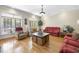 Spacious living room with hardwood floors, neutral walls, bright windows, and comfortable seating at 359 Heather Bluffs Dr, Garner, NC 27529