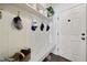 Mudroom features a built-in bench with coat hooks, storage shelves and a view of the home's front door at 359 Heather Bluffs Dr, Garner, NC 27529