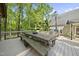 Large picnic table with built-in benches on deck, perfect for outdoor dining and entertaining at 359 Heather Bluffs Dr, Garner, NC 27529