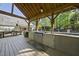 Outdoor kitchen featuring a built-in grill, sink, and ample counter space under a covered pergola at 359 Heather Bluffs Dr, Garner, NC 27529