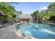 Backyard pool surrounded by a wooden deck with lounge chairs, perfect for outdoor relaxation at 359 Heather Bluffs Dr, Garner, NC 27529