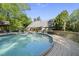 Backyard oasis with a sparkling pool and surrounding deck, showcasing the gazebo, lounging area, and lush landscaping at 359 Heather Bluffs Dr, Garner, NC 27529