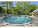 Inviting pool area featuring a sparkling pool, wooden deck, gazebo, and outdoor seating, perfect for relaxation at 359 Heather Bluffs Dr, Garner, NC 27529