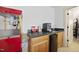 Wet bar and refreshment center including a popcorn machine and beverage fridge for entertaining at 359 Heather Bluffs Dr, Garner, NC 27529