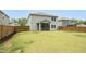 Exterior view of the home, including the backyard and screened-in porch at 3804 Delves Ln, Raleigh, NC 27616