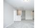 Upstairs loft with neutral walls, carpet flooring, and two entry doors at 3804 Delves Ln, Raleigh, NC 27616