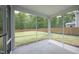 View from screened porch featuring a large, fenced backyard, and ample natural light at 3804 Delves Ln, Raleigh, NC 27616
