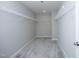 A walk-in closet with carpet, wire shelves, and neutral walls at 3804 Delves Ln, Raleigh, NC 27616