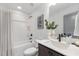 Clean bathroom with white shower/tub combo, dark vanity and white countertops at 3922 Lost Fawn Ct, Raleigh, NC 27612