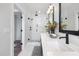 Elegant bathroom featuring a double vanity, a glass-enclosed shower, and stylish fixtures for a luxurious experience at 3922 Lost Fawn Ct, Raleigh, NC 27612