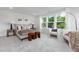 Well-lit bedroom features a comfortable bed, a seating area, and ample natural light, creating a welcoming and relaxing space at 3922 Lost Fawn Ct, Raleigh, NC 27612
