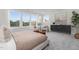 Bright bedroom with multiple windows offers natural light, complemented by modern furniture and stylish decor at 3922 Lost Fawn Ct, Raleigh, NC 27612