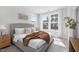 Bright bedroom with a large windows providing lots of natural light, and a cozy, neutral decor at 3922 Lost Fawn Ct, Raleigh, NC 27612
