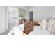 Serene bedroom featuring a cozy brown blanket, neutral decor, and a walk-in closet at 3922 Lost Fawn Ct, Raleigh, NC 27612