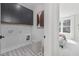 Functional laundry room with cabinetry and stylish tile, conveniently located near the bedroom for easy access at 3922 Lost Fawn Ct, Raleigh, NC 27612