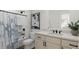 Modern bathroom featuring a shower, vanity, and black fixtures against a neutral palette at 3926 Lost Fawn Ct, Raleigh, NC 27612