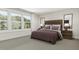 Serene bedroom with large windows providing natural light and a comfortable inviting aesthetic at 3926 Lost Fawn Ct, Raleigh, NC 27612