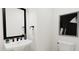 Stylish powder room featuring modern fixtures, a sleek mirror, and clean, minimalist design for a contemporary touch at 3926 Lost Fawn Ct, Raleigh, NC 27612