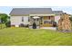 Well-kept backyard with stone fireplace, patio, deck, gazebo, and cozy outdoor seating at 40 Senter Farm Ct, Fuquay Varina, NC 27526