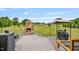 Spacious backyard featuring a brick patio, stone fireplace, gazebo, and a well-maintained lawn at 40 Senter Farm Ct, Fuquay Varina, NC 27526