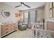 Bright Bedroom with crib, dresser, comfortable chair and stylish decor at 40 Senter Farm Ct, Fuquay Varina, NC 27526