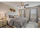 Relaxing bedroom with neutral tones, ceiling fan, and natural light at 40 Senter Farm Ct, Fuquay Varina, NC 27526