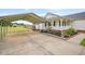 Spacious carport with concrete drive and lush landscaping leading to the home at 40 Senter Farm Ct, Fuquay Varina, NC 27526