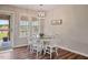 Cozy dining area with white wood table and chairs and an outdoor view at 40 Senter Farm Ct, Fuquay Varina, NC 27526