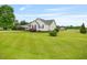 A lovely home with lush green lawn, carport, and blooming bushes at 40 Senter Farm Ct, Fuquay Varina, NC 27526