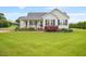 Charming one-story home featuring a covered front porch, black shutters, and a well-manicured lawn at 40 Senter Farm Ct, Fuquay Varina, NC 27526