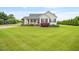 Charming one-story home featuring a covered front porch, black shutters, and a well-manicured lawn at 40 Senter Farm Ct, Fuquay Varina, NC 27526