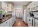 Open kitchen featuring white appliances and a view of the dining area at 40 Senter Farm Ct, Fuquay Varina, NC 27526