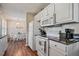 Open kitchen featuring white appliances and a view of the dining area at 40 Senter Farm Ct, Fuquay Varina, NC 27526