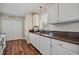 Bright kitchen with white cabinets, laminate countertop, and modern appliances at 40 Senter Farm Ct, Fuquay Varina, NC 27526