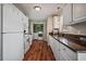 Bright kitchen with white cabinets, laminate countertop, and modern appliances at 40 Senter Farm Ct, Fuquay Varina, NC 27526