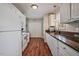 Bright kitchen with white cabinets, laminate countertop, and modern appliances at 40 Senter Farm Ct, Fuquay Varina, NC 27526