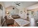 Inviting living room featuring vaulted ceilings, ceiling fan, and comfortable seating at 40 Senter Farm Ct, Fuquay Varina, NC 27526
