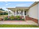 Inviting covered front porch with white railing and steps at 40 Senter Farm Ct, Fuquay Varina, NC 27526