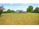 Sprawling fenced backyard showing large manicured yard with mature trees at 40 Senter Farm Ct, Fuquay Varina, NC 27526