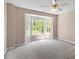 Spacious bedroom with carpet floors, ceiling fan, and a large bay window at 4012 Graham Newton Rd, Raleigh, NC 27606