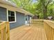 The backyard has a spacious wooden deck, perfect for outdoor gatherings and relaxation at 42 S 2Nd St, Roxboro, NC 27573