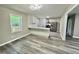 Open kitchen featuring stainless steel appliances, white cabinets, and gray-toned floors at 42 S 2Nd St, Roxboro, NC 27573