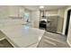 Kitchen featuring stone countertops, stainless steel appliances and white cabinets at 42 S 2Nd St, Roxboro, NC 27573