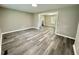 Spacious living room featuring gray toned floors and a glimpse into the kitchen area at 42 S 2Nd St, Roxboro, NC 27573