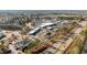 Aerial view of commercial real estate featuring businesses, parking lots, and roadways at 4208 Louisbury Rd, Wake Forest, NC 27587