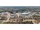 Aerial view of commercial real estate with retail buildings, parking areas, and roads at 4208 Louisbury Rd, Wake Forest, NC 27587