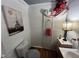 Compact bathroom featuring a toilet, sink, and decorative accents at 4208 Louisbury Rd, Wake Forest, NC 27587